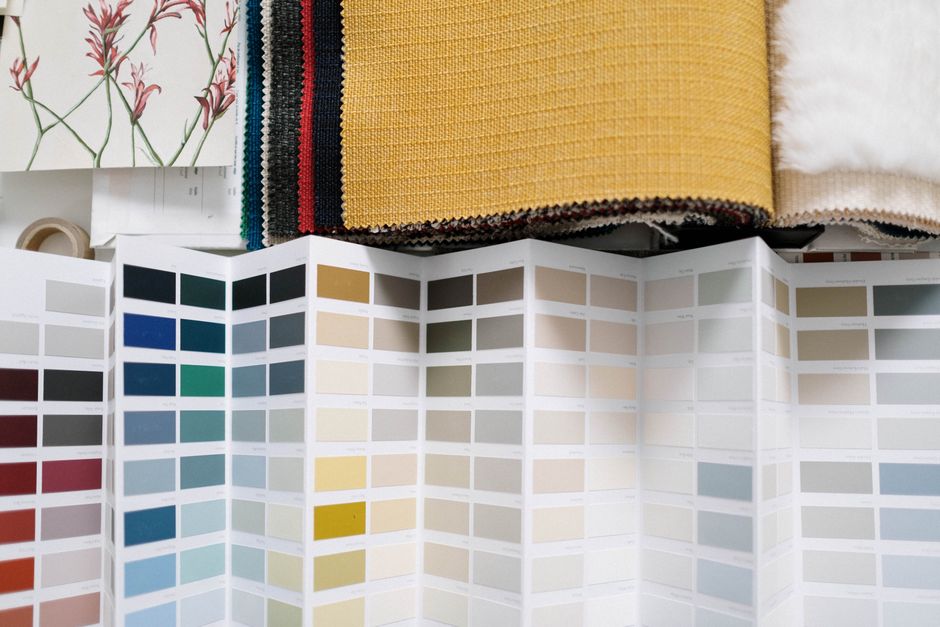 A variety of fabric swatches alongside a detailed color palette for design inspiration.